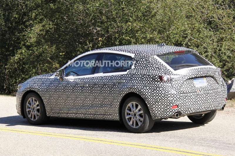 New Mazda3 hatchback test prototype side-rear view_no_copyright